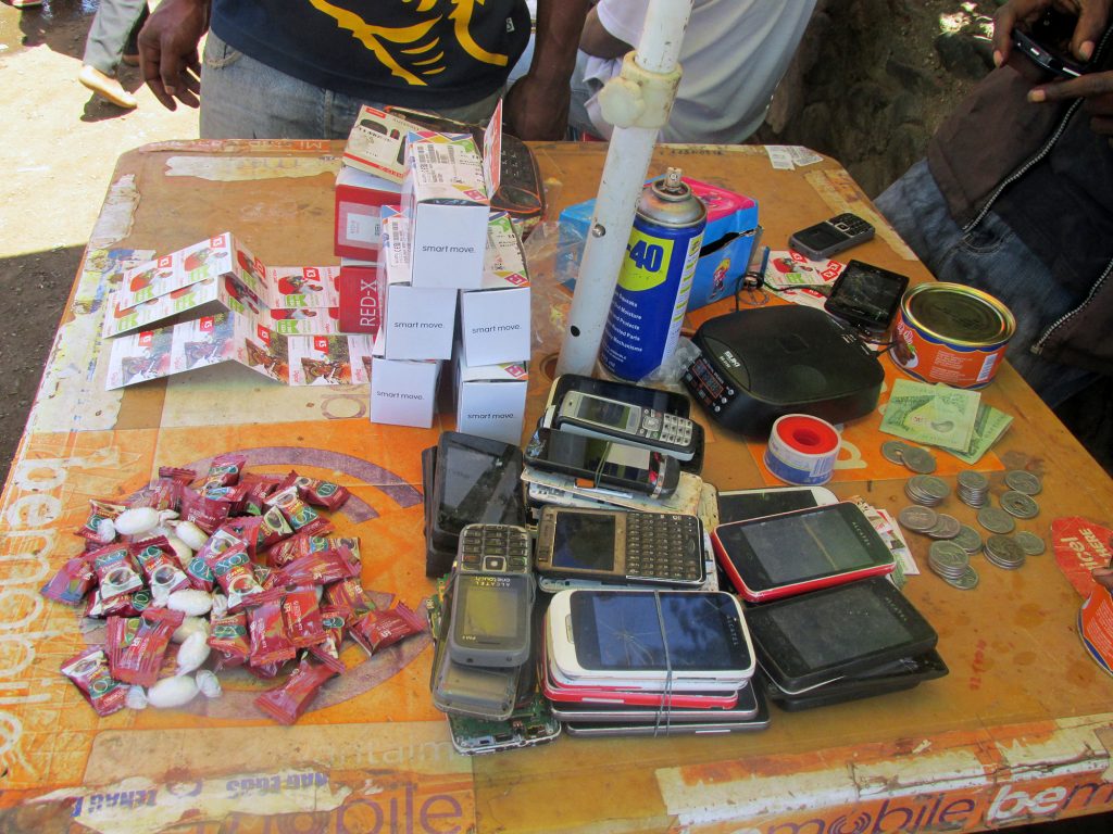 Phone repair vendor’s table, Goroka, 2015