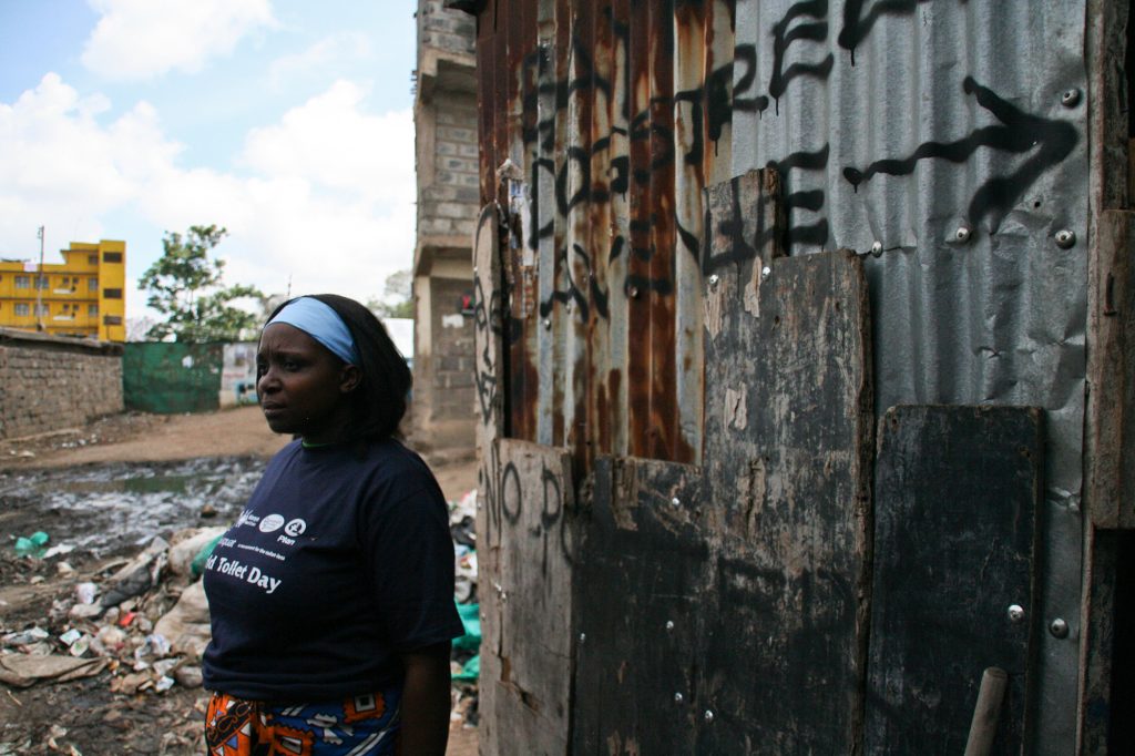 Tabitha taking a break following a community clean on World Toilet Day. Mathare 2010. Photo by: Sasha Turrentine