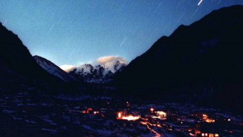 Figure 4. A photograph of the lights of Langtang village, taken shortly after the installation of the first micro-hydropower project in 1998 (K. Togami, The Tokyo Shimbun).