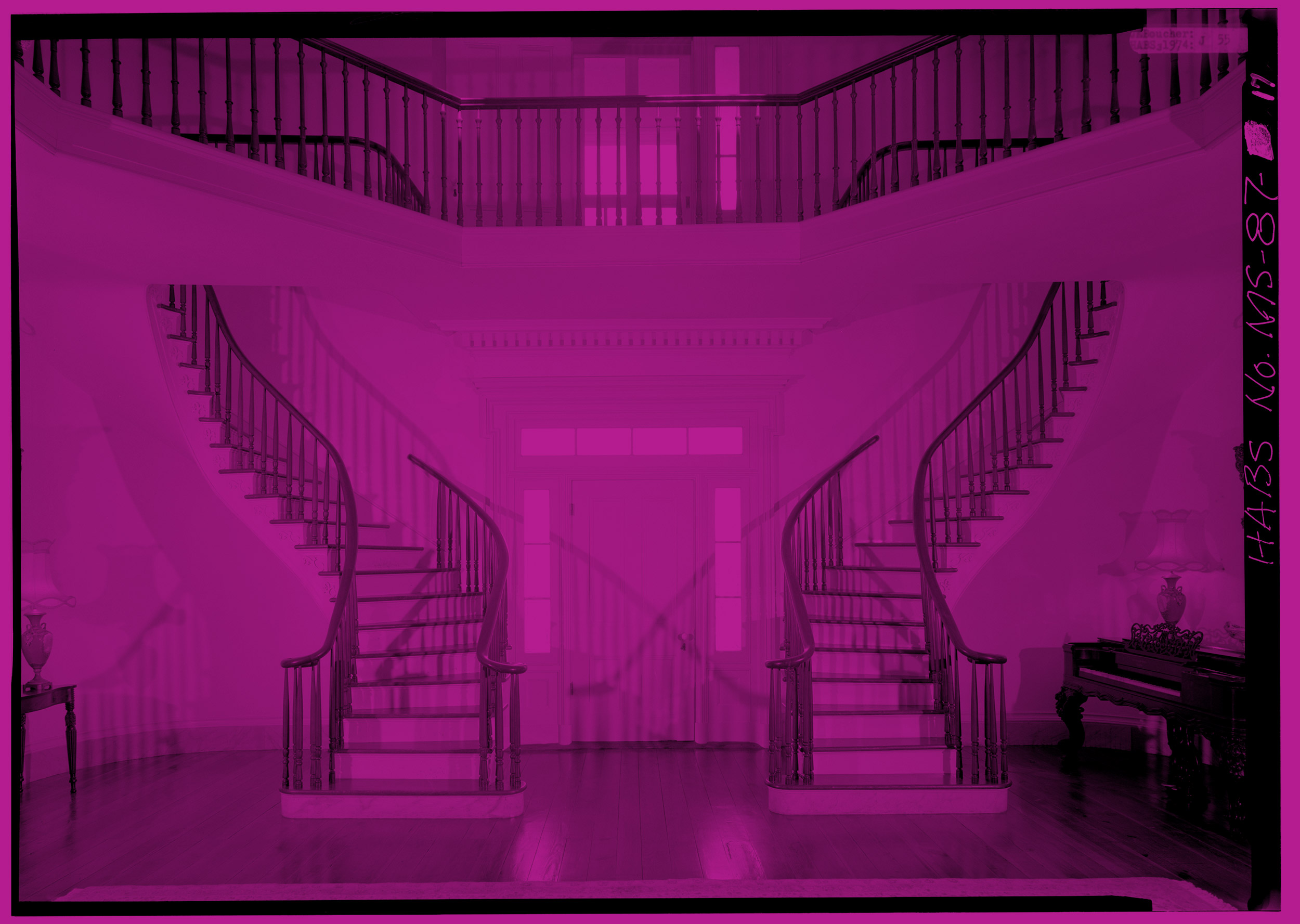 photo of two staircases in a grand lobby, tinted magenta